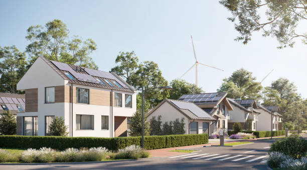 Digital renders of sustainable town with solar panels and wind energy 3d renders of sustainable houses with windmills. Sustainable sloped house with garden. slopestyle stock pictures, royalty-free photos & images