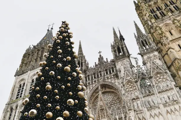 Photo of Decorated Christmas tree and cathedral in Rouen