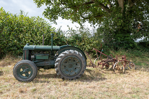 Ilminster.Somerset.United Kingdom.August 21st 2022.A green standard Fordson from the world war two era is on display at a Yesterdays Farming event