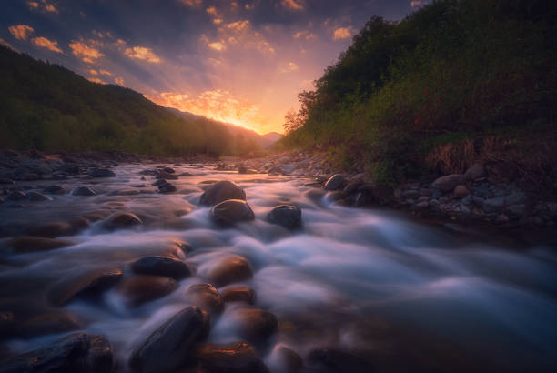 istock Magical sunrise over fast flowing mountain river 1429156964