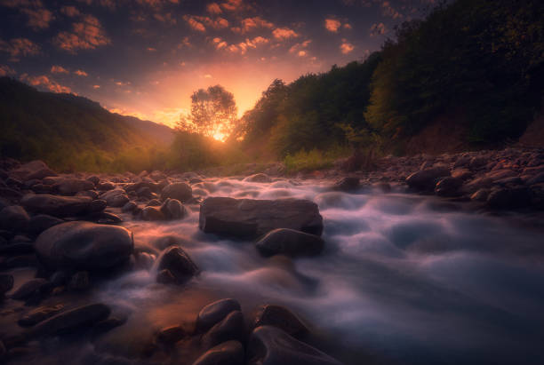 istock Magical sunrise over fast flowing mountain river 1429156965