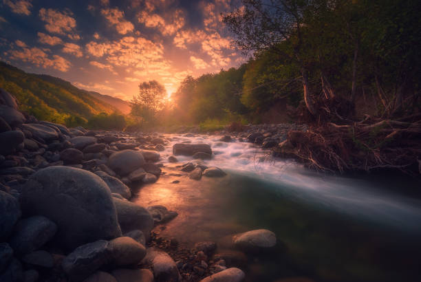 istock Magical sunrise over fast flowing mountain river 1429157023