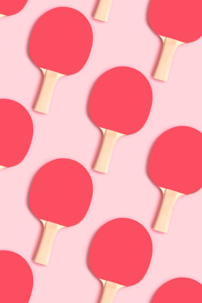 istock Repetitive pattern made of red tennis racket on a pink pastel background. 1429161908
