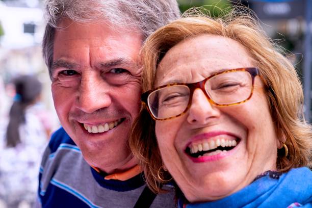 istock Smiling senior couple looking at the camera 1429163435