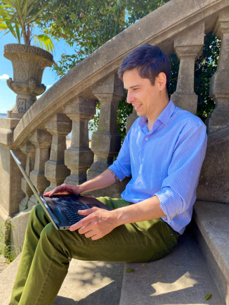 istock man studying with laptop outdoors 1429163893