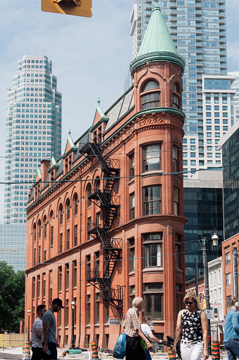 Toronto, ON, Canada - August 5, 2022: The Gooderham Building, also known as the Flatiron Building, is a historic office building at 49 Wellington Street East in Toronto, Ontario, Canada.