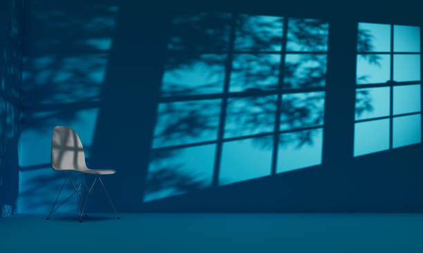 istock Single Chair in Empty Blue Room with Shadows From Windows and Trees 3D Illustration 1429185699