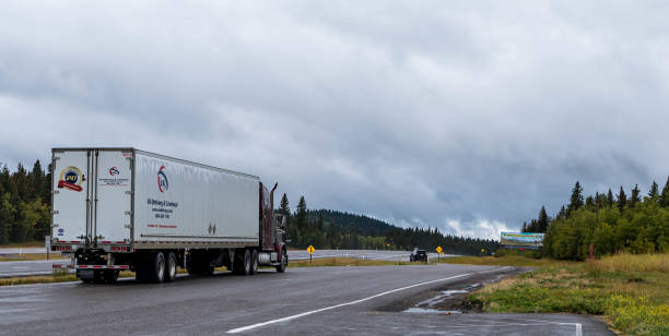 Calgary, Alberta, Canada September 19, 2022 A tractor trailer truck parked at a rest stop on the Trans-Canada Highway on an overcast late summer day