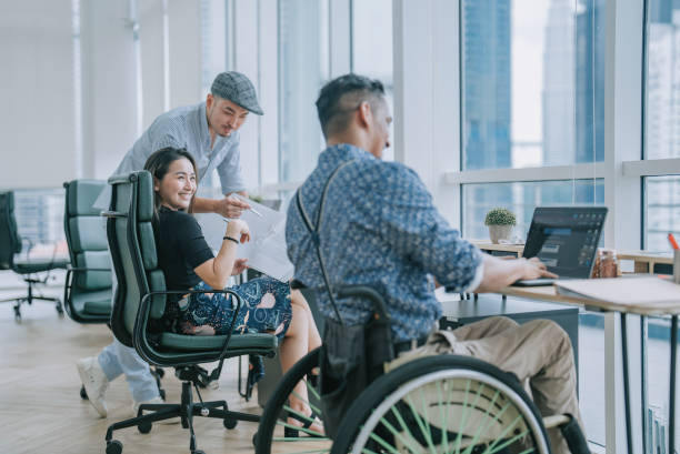 istock diversify Asian white collar  worker discussion conversation coworking in creative office workstation beside window 1429188019
