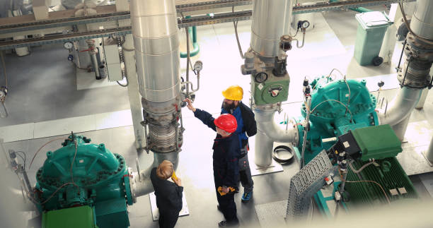 istock The heating workers show the supervisors that the valves on the pipes are working properly. 1429191436