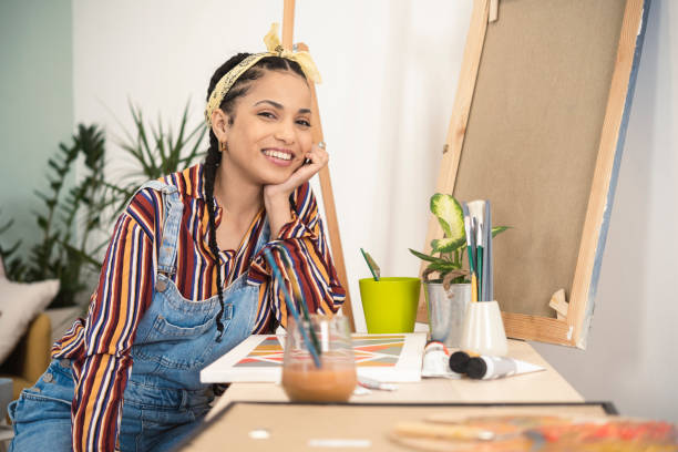 istock Portrait of a beautiful painter working on a new canvas and enjoying 1429191670