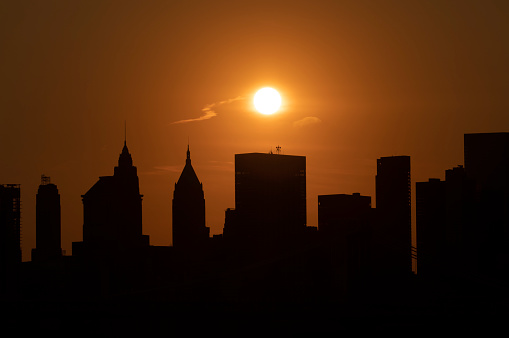 Sun setting over the Lower Manhattan skyline