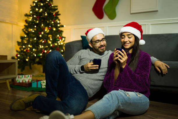 istock Relaxed couple drinking hot tea during christmas holidays 1429206862