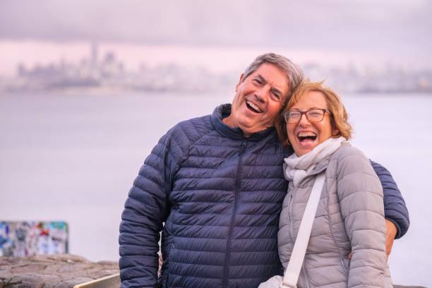 istock Smiling senior couple looking at the camera 1429210467