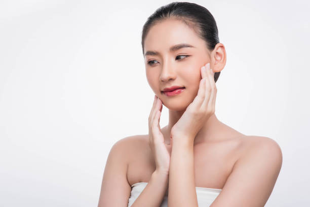 istock Beautiful woman, good looking face, touch her face. 1429216039