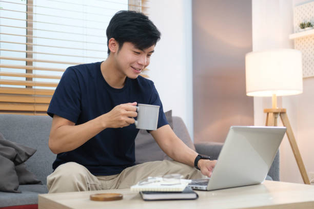 istock Asian man freelancer in casual clothes browsing internet, replies to email or working online via laptop computer. 1429225005