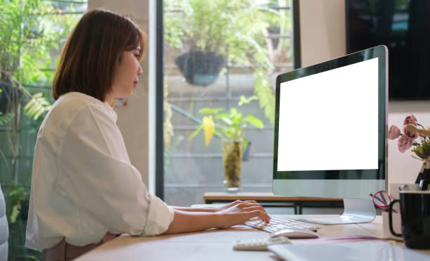 istock Side view female employee working in contemporary workplace. 1429225072