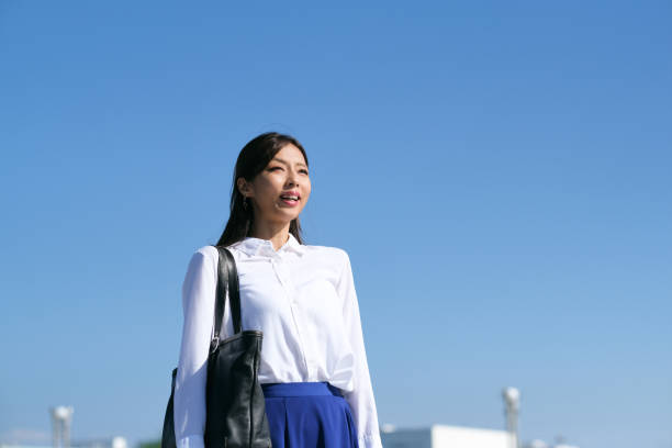 istock Blue sky and businesswoman 1429226176