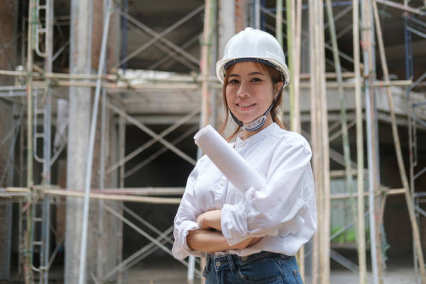 istock Confident female engineer or architect standing with crossed arms and looking at camera. 1429226592
