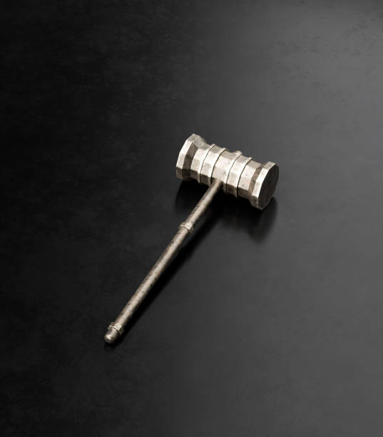 istock A medieval hammer on the ground, isolated single ancient tool, 3d rendering 1429227630