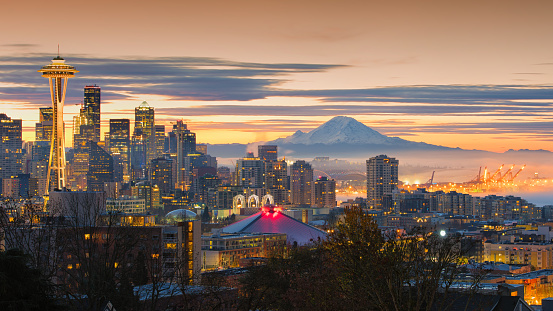 Panorama of downtown Seattle and Mt. Rainier at sunset.  