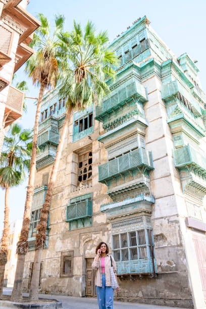 istock Local woman walking through Al-Balad and using phone 1429231342