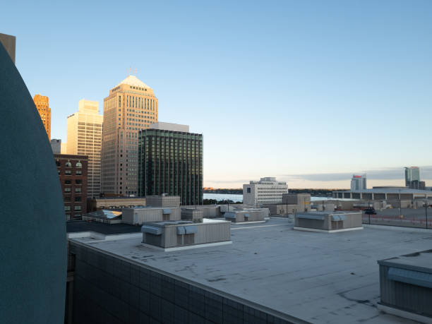 Downtown Detroit view View of Downtown Detroit from a parking garage on a clear day in Detroit, Michigan. Windsor, Ontario can be seen in the distance. cobo hall photos stock pictures, royalty-free photos & images