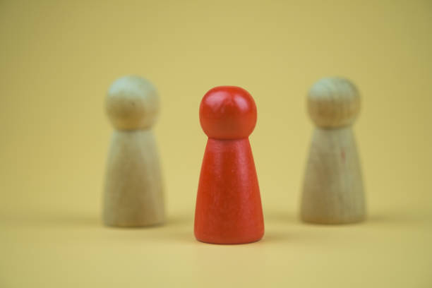 istock One red pawn among no color ones. Difference and uniqueness concept. 1429236926