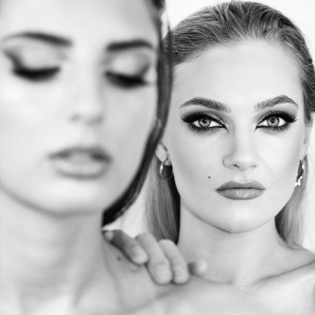 istock Two beautiful women with smokey makeup close-up studio portrait 1429237118