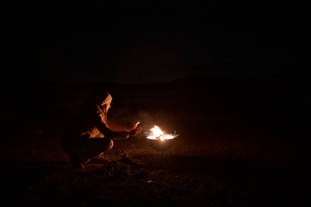 istock People and Nature. Woman at campfire. 1429245939