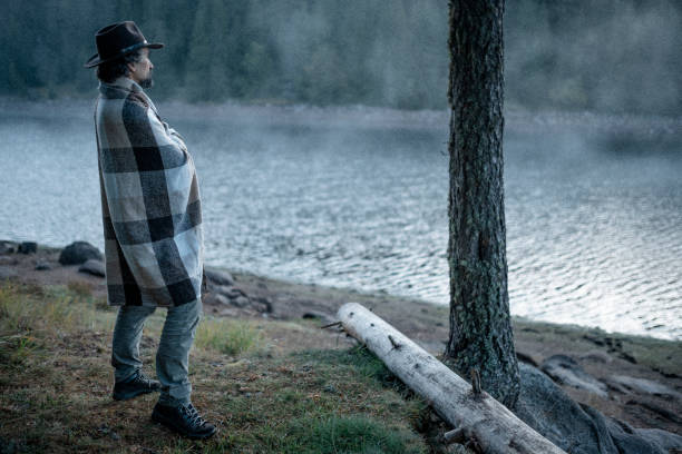 istock People and Nature. Man at lakeshore. 1429247279