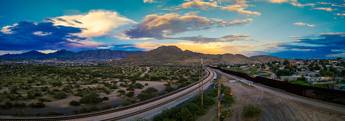 Railway track in the evening in sunset. Panoramic view on the railroad switch.