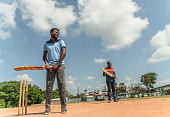 istock The street team playing cricket in Sri Lanka. The batsmen are defending the base - hitting the ball with a bat. 1429255886