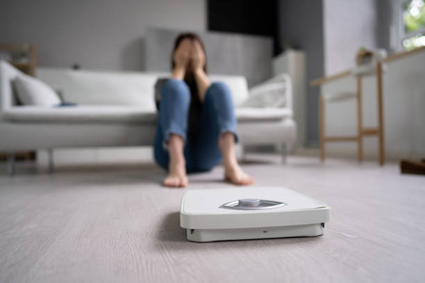 istock Sad Woman On Weight Scale After Diet 1429256267