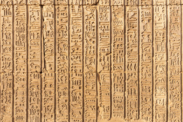 istock Part of an egyptian temple hieroglyphs engraved on the wall 1429256549