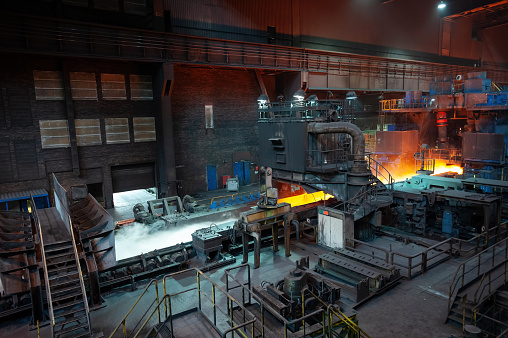 Metallurgical factory in Germany, hot rolled metal conveyor, sheet steel production.