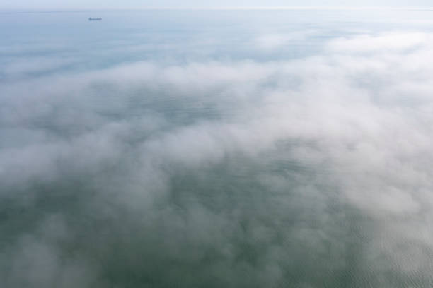 istock Low Clouds Over Black Sea. Fog over sea 1429259774