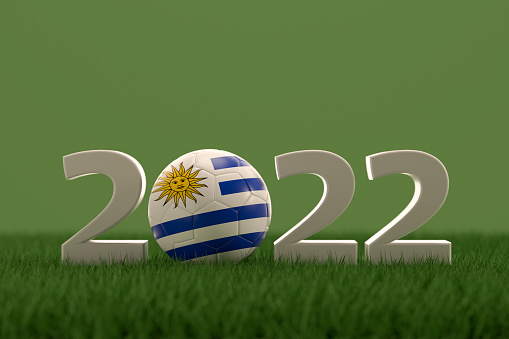 3d rendering of soccer ball with Uruguay flag on a grass field.  .