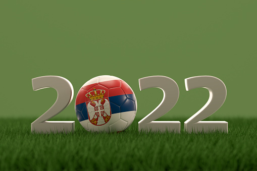 3d rendering of soccer ball with Serbia flag on a grass field.  .