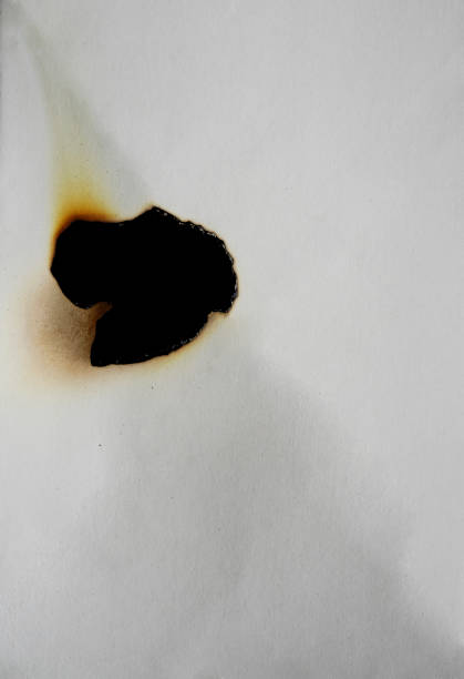 istock burnt paper frame for texture overlay. damaged white paper with burnt stain background. blank ripped paper edge for a design element. 1429263298