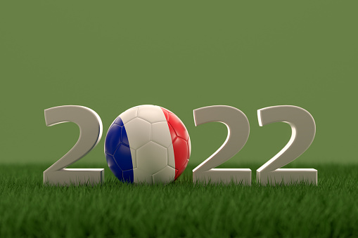 3d rendering of soccer ball with France flag on a grass field.  .