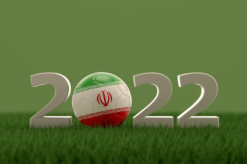 3d rendering of soccer ball with Iran flag on a grass field.  .