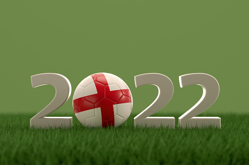 3d rendering of soccer ball with England flag on a grass field.  .