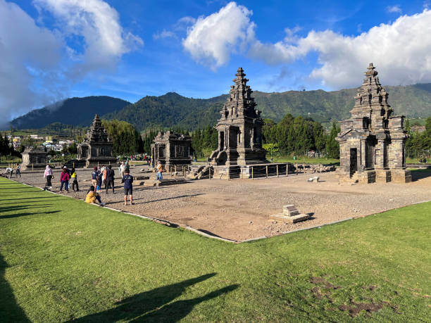 Local tourists visit Arjuna temple complex at Dieng Plateau Local tourists visit Arjuna temple complex at Dieng Plateau dieng plateau stock pictures, royalty-free photos & images