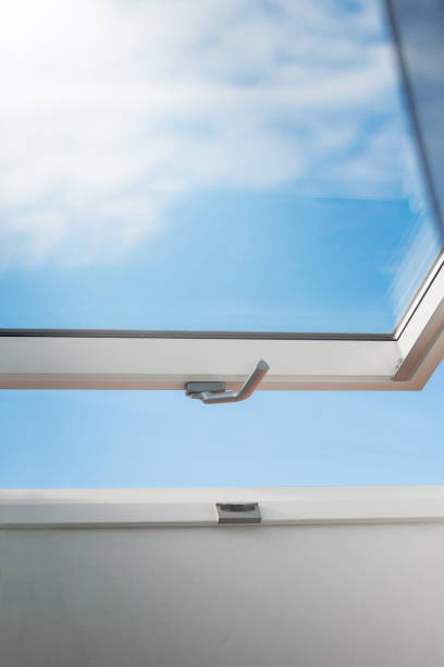 istock Skylight on a sloping roof with a movable frame for ventilation and light 1429270114