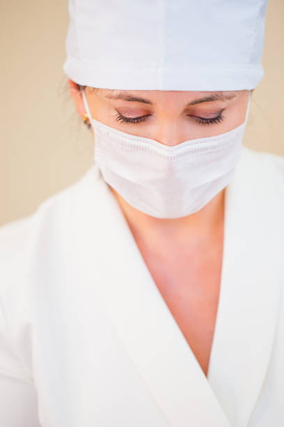 Advertising concept.Doktor her finger to the sides with copy space for your information.Doktor points her finger on a white background.Woman touching an imaginary screen with her finger.
