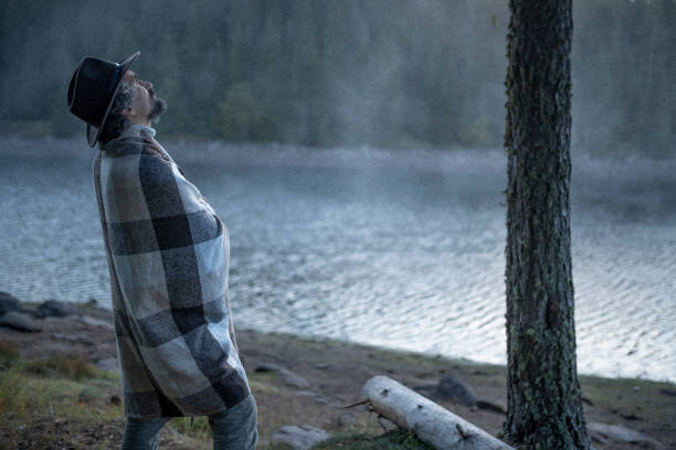 istock People and Nature. Man at lakeshore. 1429273038