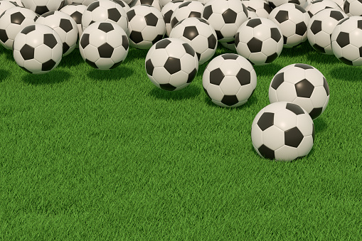3d rendering of soccer balls on grass field green background