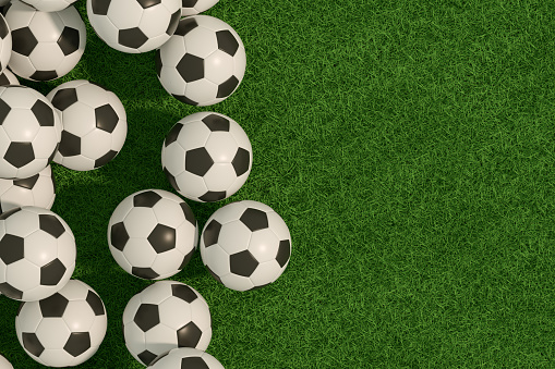 3d rendering of soccer balls on grass field green background