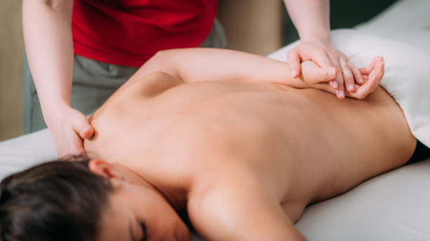 istock Back Massage In A Massage Salon, Woman Having A Relaxing Back Massage. 1429276112